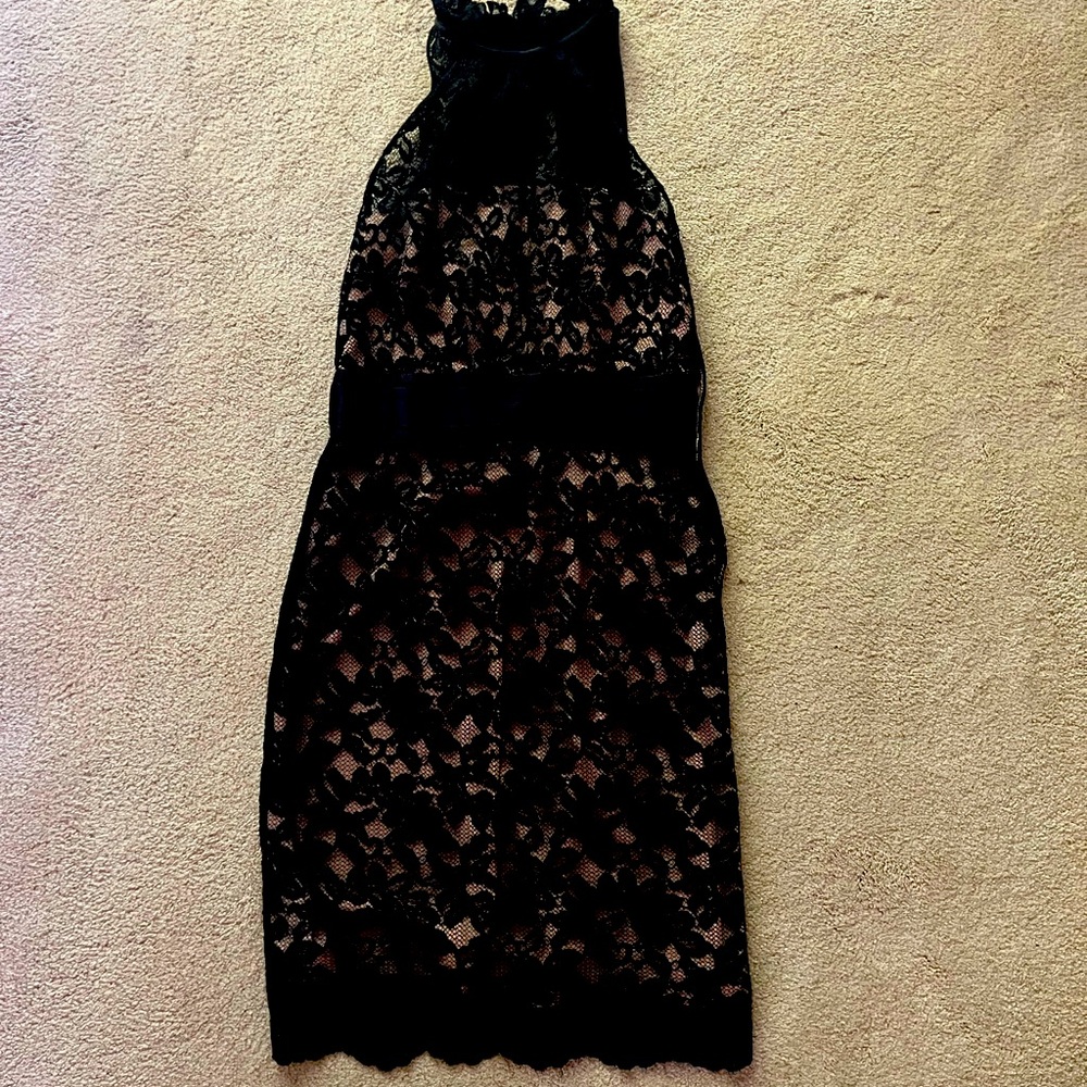Black lace overlay, nude color under lining.